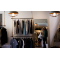 Racks with men's apparel on the walls of a clothes store