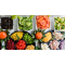Colorful salad bar with greens, broccoli, black olives, peppers and more
