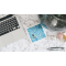 A Macbook and other items on top of a marble 