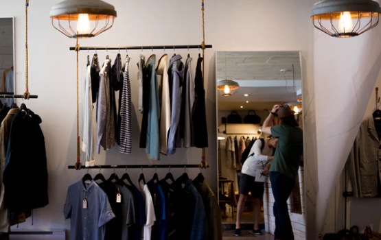 Racks with men's apparel on the walls of a clothes store