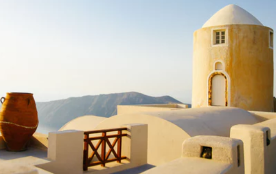 A stone building with a dome in Santorini